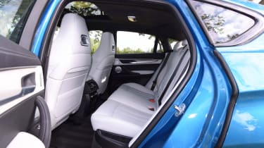 Despite its curving roofline, the X6 M still has enough space in the back for three adults