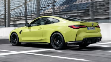 2021 BMW M4 Competition Coupe - rear 3/4 view dynamic 
