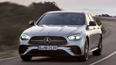 Mercedes E-Class driving - front view with headlights on
