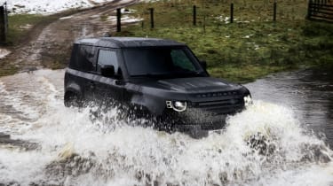 Land Rover Defender V8 90 driving through water