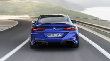 BMW M8 Competition coupe - rear view driving 