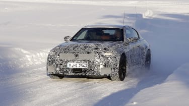 2022 BMW M2 spy shot snow driving front