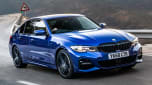 Blue BMW 3 Series driving