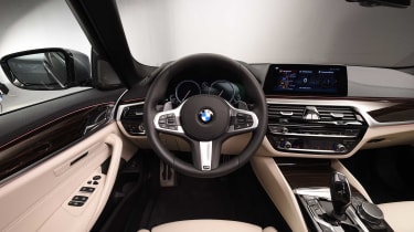 The BMW 5 Series&#039; dashboard is a masterclass in high-quality executive luxury