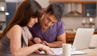 Two people looking at paperwork