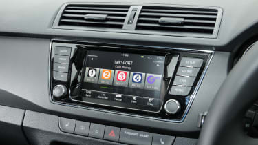 The infotainment system includes Apple CarPlay and Android Auto functionality