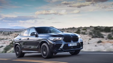BMW X6 M Competition driving - front side view