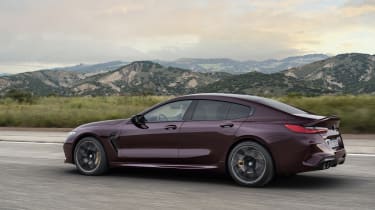 BMW M8 Gran Coupe driving - left side view