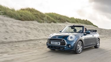 MINI Sidewalk Convertible driving on sand with roof down