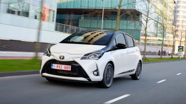 Toyota Yaris driving in a city