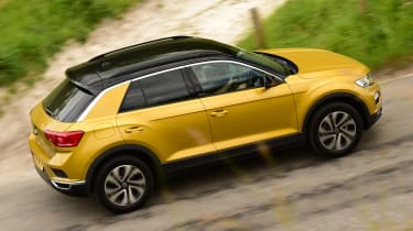 Gold VW T-Roc driving uphill