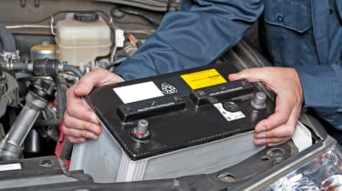 Battery being removed from car