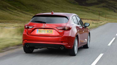On a twisty road the Mazda3 almost has the measure of the Ford Focus