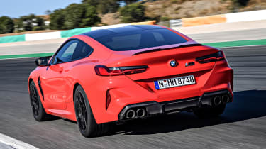 BMW M8 Competition coupe rear 3/4 tracking on track