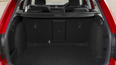 A hatch in the rear seatback allows long items to intrude into the passenger compartment