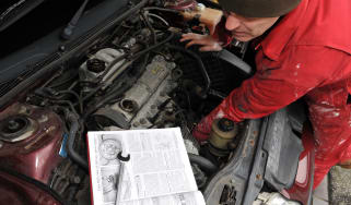 Mechanic working on car