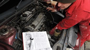 Mechanic working on car