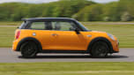 Yellow MINI driving - side view