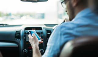 Driver using a phone behind the wheel