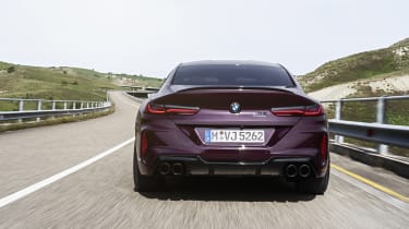 BMW M8 Gran Coupe driving - rear view