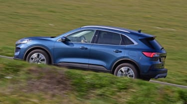 Ford Kuga driving up hill - side view