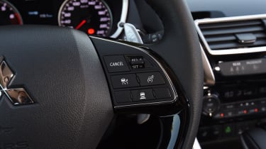 Steering wheel control buttons activate features such as active cruise control...