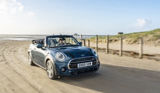 MINI Sidewalk Convertible driving on beach with roof down