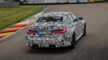 2020 BMW M3 saloon prototype - rear 3/4 view cornering 