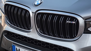 The iconic BMW kidney grille gets an M badge just in case bystanders don&#039;t hear the quad exhaust